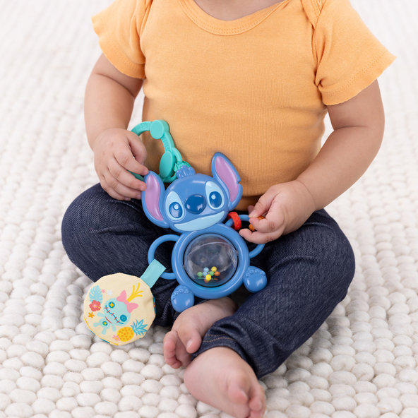 BRIGHT STARTS Senzorická hračka na C-kroužku Stitch Tummy Tumble™ 0m+